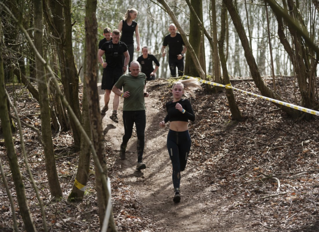 Participants running through the forest (photo article on starting and building up running).